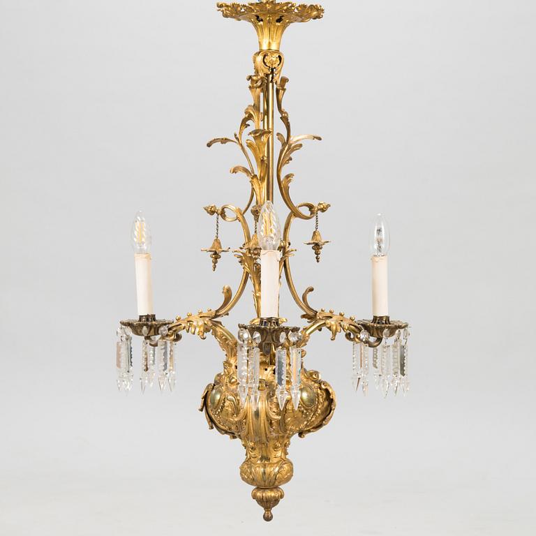 A brass chandelier with prisms, second half of the 19th century. Height 83 cm.