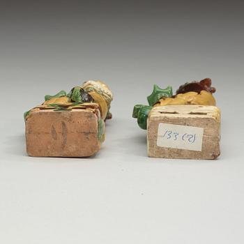 A pair of bisquit joss stick holders in the shape of buddhist lions, Qing dynasty, Kangxi (1662-1722).