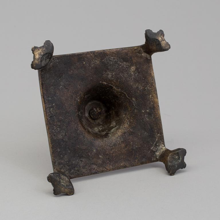 A BRONZE  CANDLESTICK, 17th century.