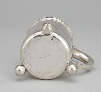 A Baroque style tankard with no silver marks.