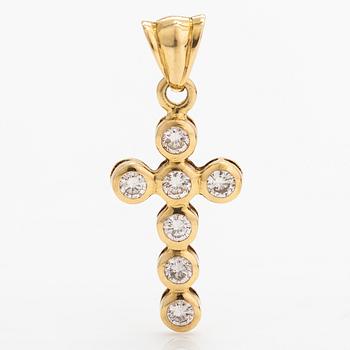 An 18K gold cross with diamonds ca. 0.42 ct in total.