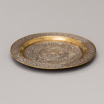 A Middle Eastern brass, silver and copper plate ca 1900.