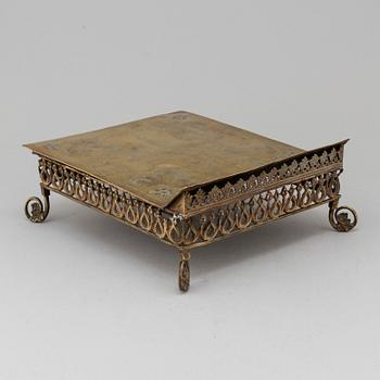 An 19th century brass book stand.