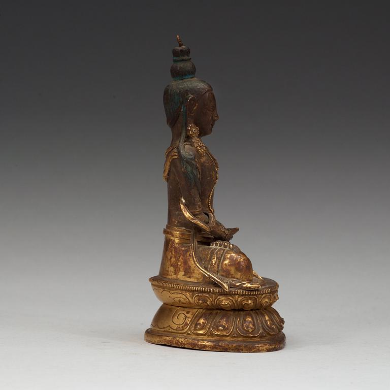 A gilt copper figure of Amitayus, Tibeto-Chinese, 18th Century.