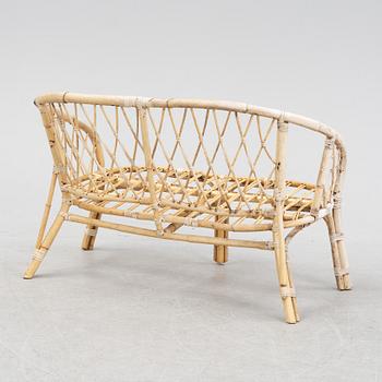 A rattan and bamboo sofa and two armchairs, second half of the 20th Century.