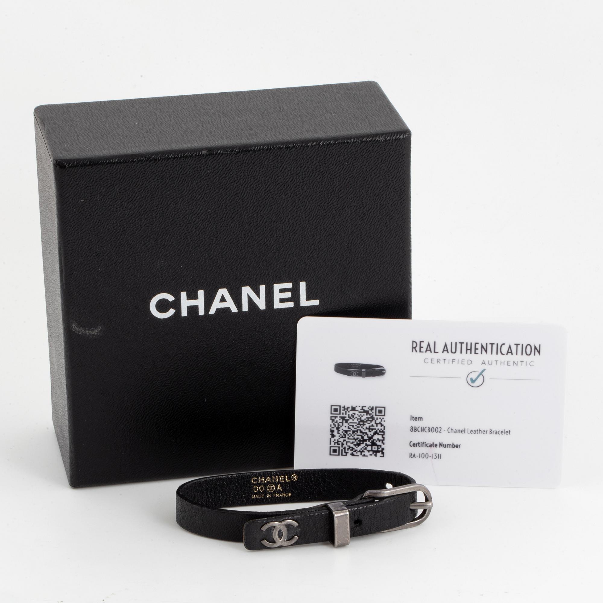 CHANEL, a leather bracelet.
