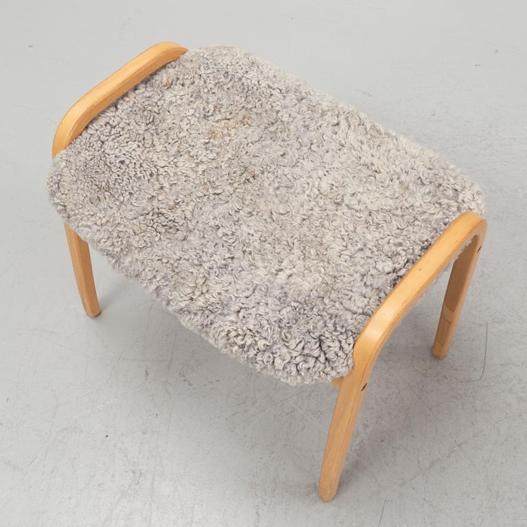 Yngve Ekström, a 'Lamino' armchair with a foot stool, Swedese.