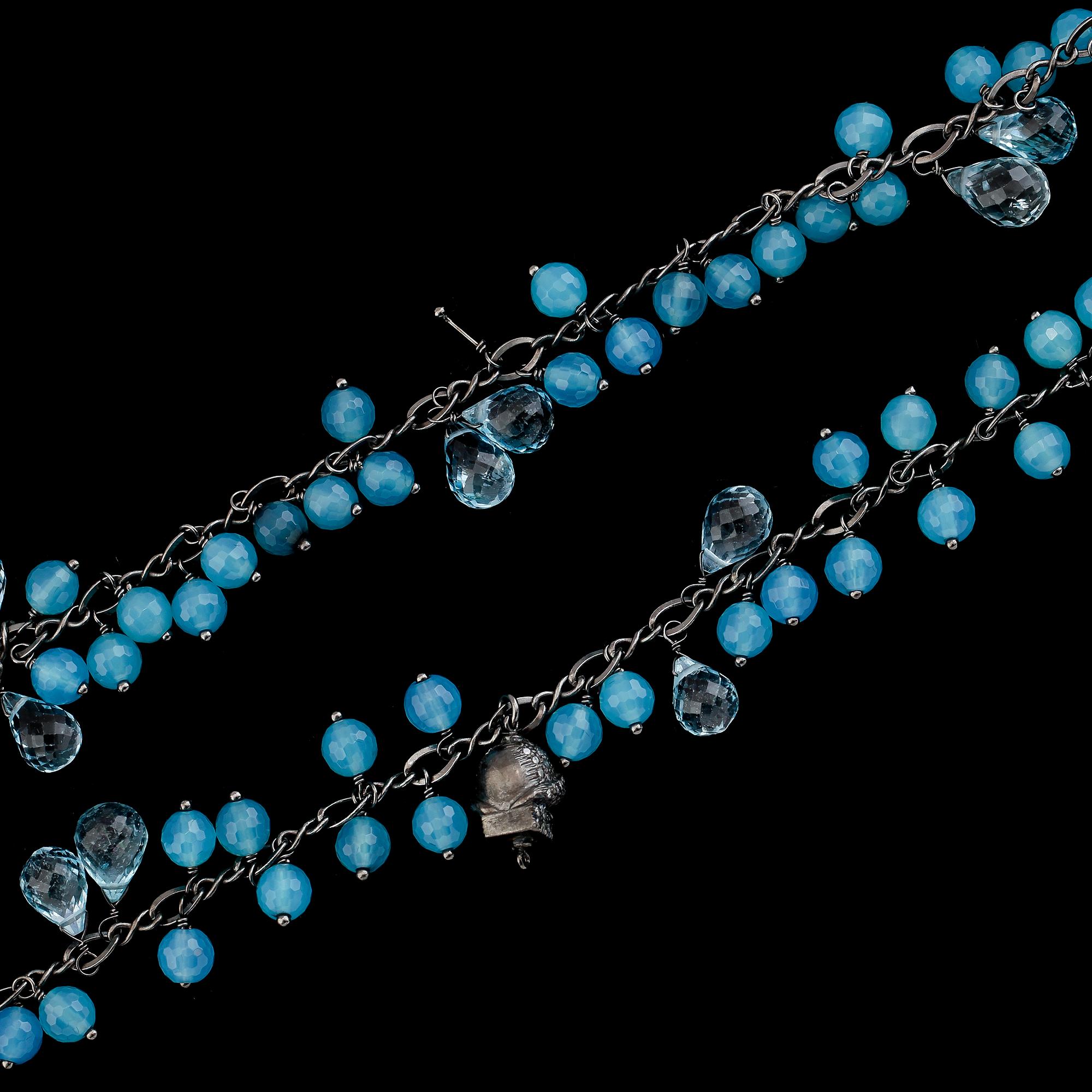 COLLIER, svärtat/rhodierat silver, turkosblå kalcedoner, blå topaser samt diamanter.