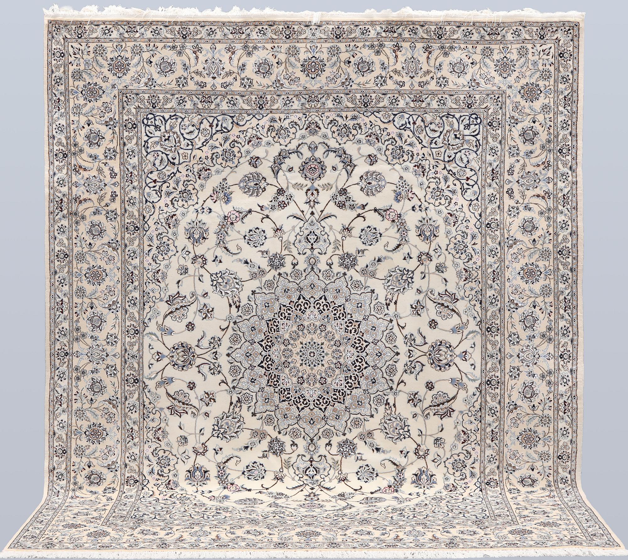 A Nain part silk carpet, 269 x 213 cm.