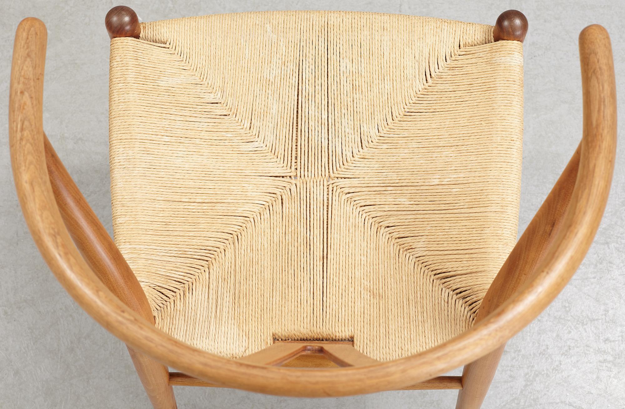 A set of four + two armchairs 'Y-chair' by Hans J Wegner, Carl Hansen & Son, Denmark.