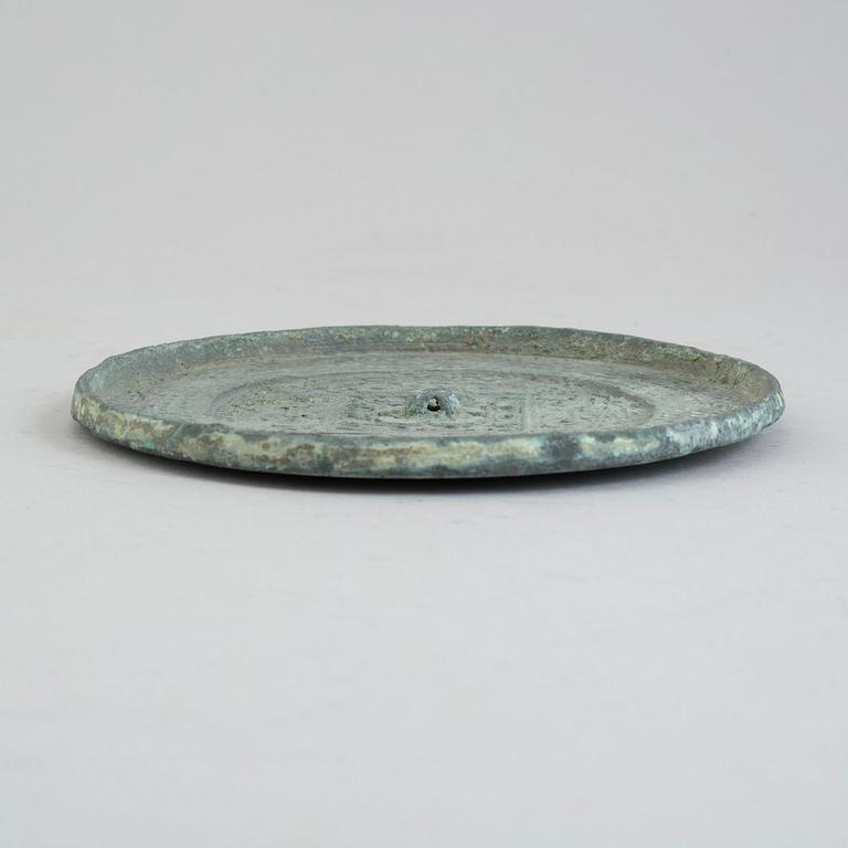 A bronze mirror, Xin-Eastern Han dynasty (9-220).
