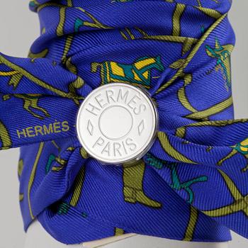 HERMÈS, two silk braclets with palladiumcovered locks.
