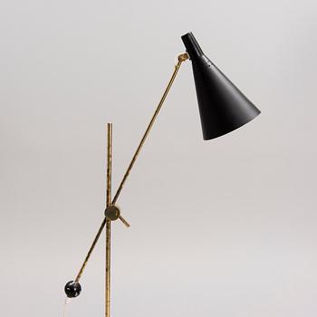 TAPIO WIRKKALA, AN ADJUSTABLE FLOOR LAMP, K10-11. Manufactured by Idman Oy. Designed in 1958.