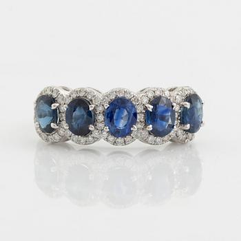 Oval sapphire and brilliant cut diamond ring.