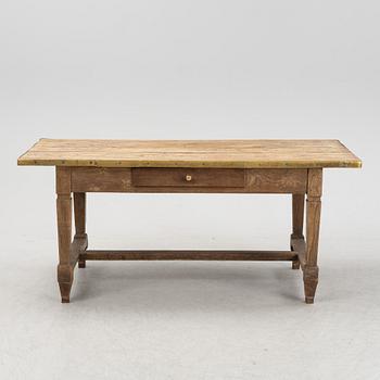 A French oak dining table, 20th Century.