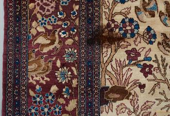 A RUG, a semi-antique Esfahan probably, figural, ca 214,5 x 137,5 cm.