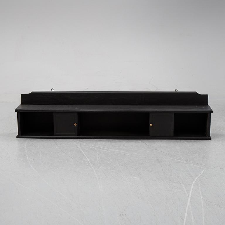 A painted wall shelf, early 20th Century.