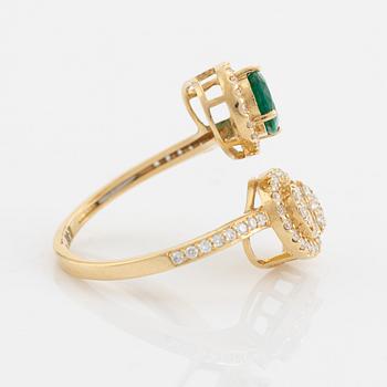 Emerald and diamond cross over ring.