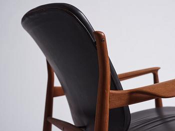 Finn Juhl, a teak and black leather 'model 136' easy chair, France & Daverkosen, Denmark 1950-60s.