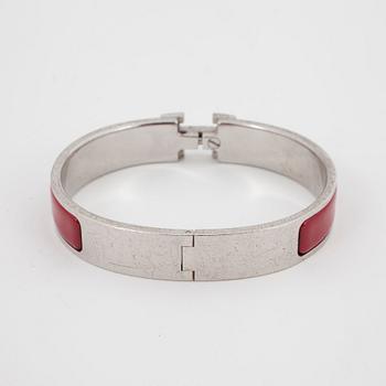 HERMÈS, a red enameled bracelet, "Clic H".