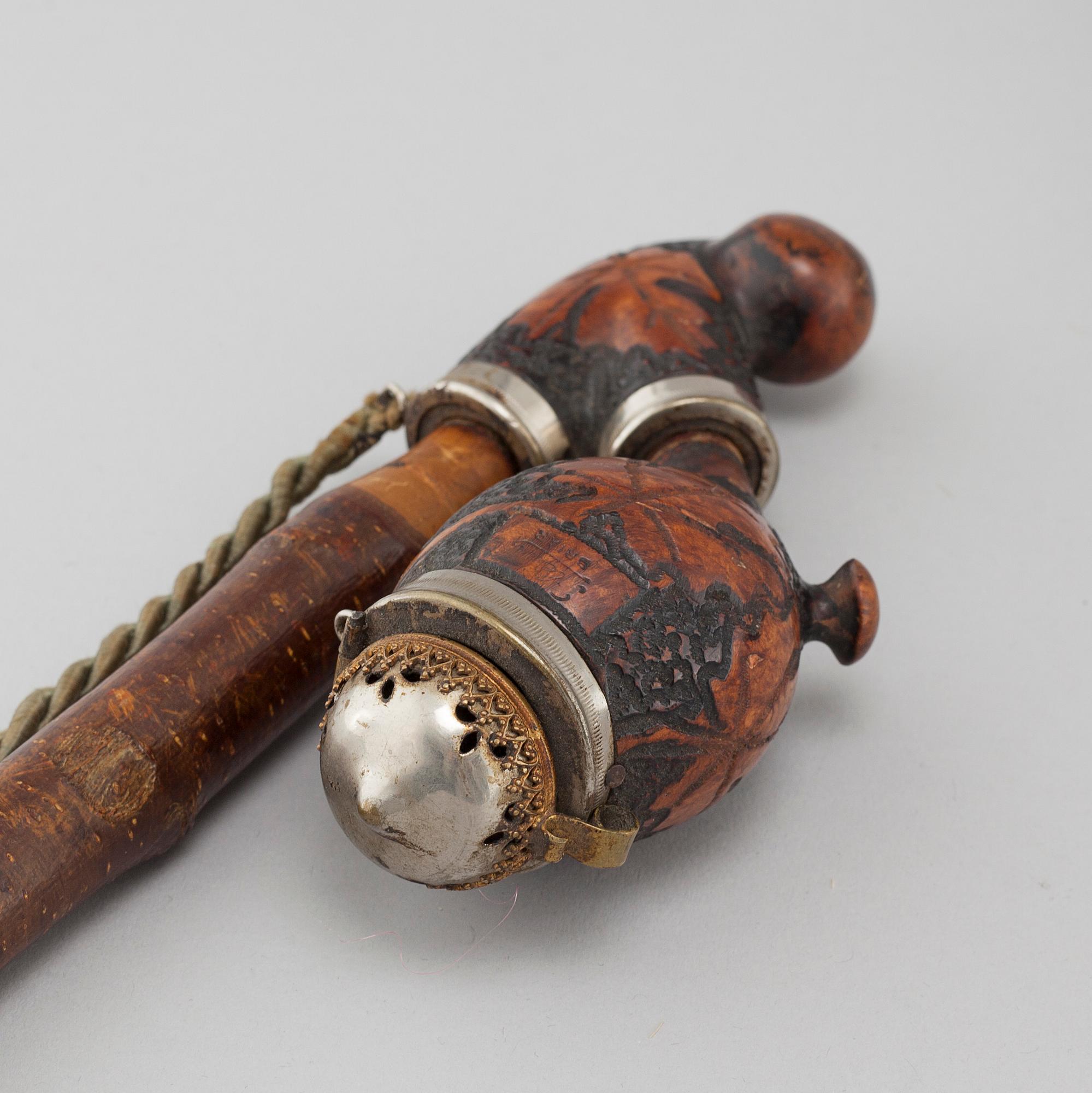 Three mainly 19th century pipes, one dated 1711.