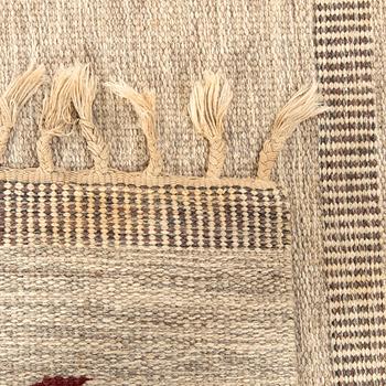A Swedish flat weave carpet signed SH ca 243 x 162 cm.