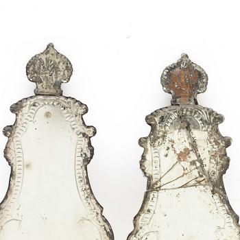 A pair of Nort European late baroque one-light girandole mirrors, mid 18th century.