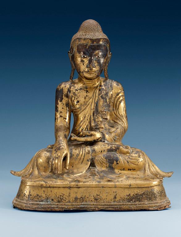 A Burmese gilt bronze figure of Buddha, Mandalay, 19th Century.