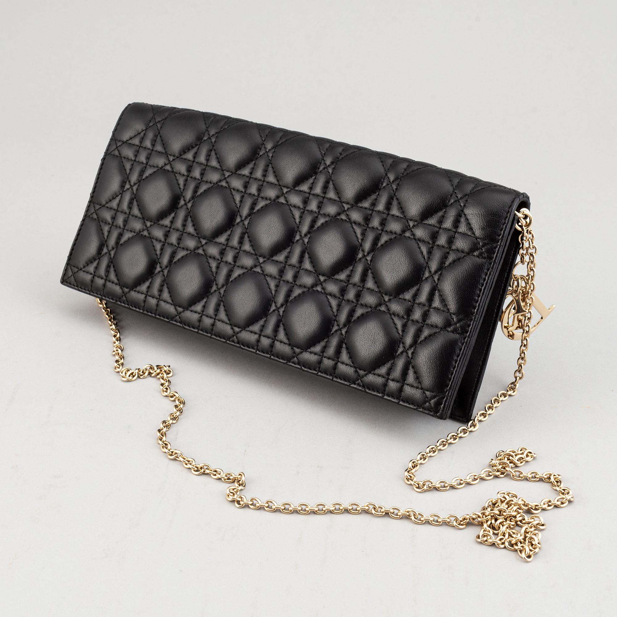 Christian Dior, a quilted leather handbag/clutch.