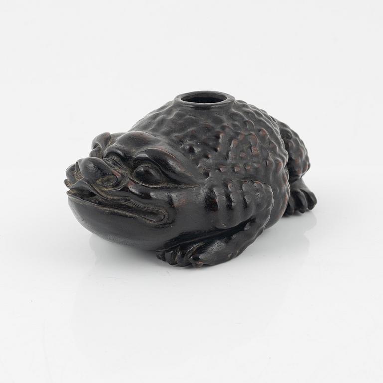 A wooden brushpot in the shape of a three legged toad, China, 20th Century.