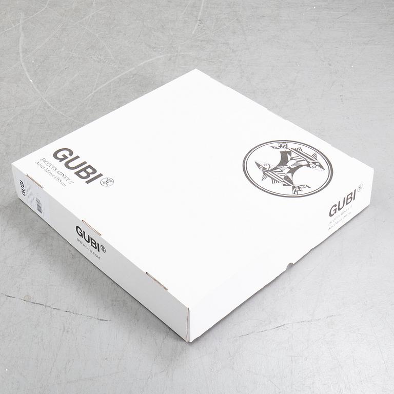 A mirror "Adnet" with leather hanging in original box, designed 1950 by Jacques Adnet for Gubi, Denmark.