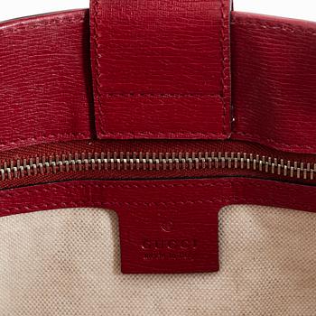 Gucci, a bamboo handle canvas handbag.