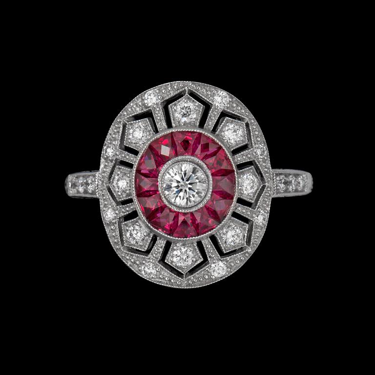 A diamond 0.38cts and step-cut ruby 0.50ct ring.