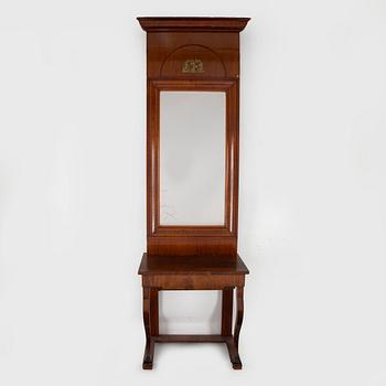 A first half of the 19th century mahogany veneered mirror and table.