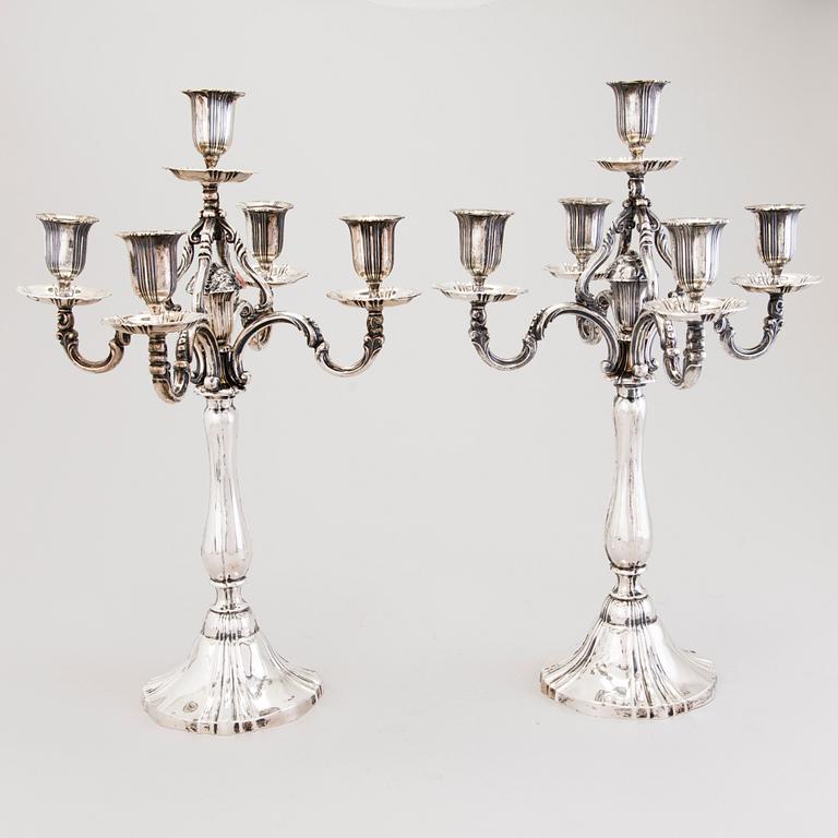 A pair of silver candelabra, presumably German, with Finnish control marks by Alexander Tillander, Helsinki.