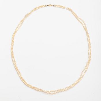 A two-strand pearl collier with cultured pearls and 14K gold clasp.
