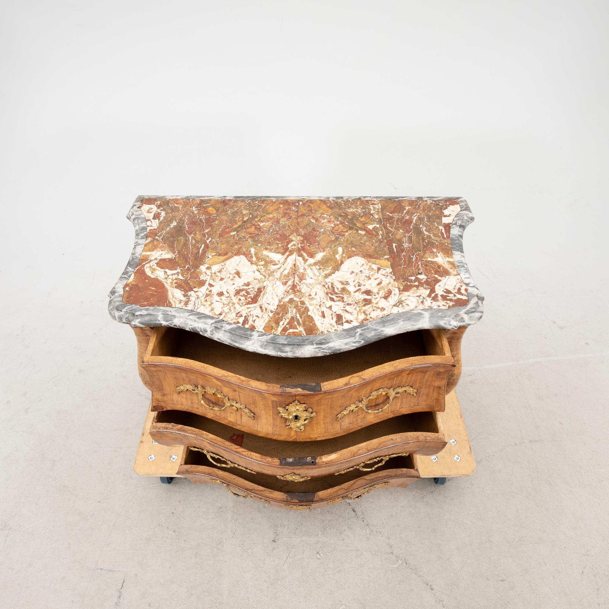 A mid 1700s Rococo dresser.