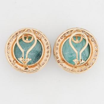 Cabochon cut malachite and brilliant-cut diamond earrings.