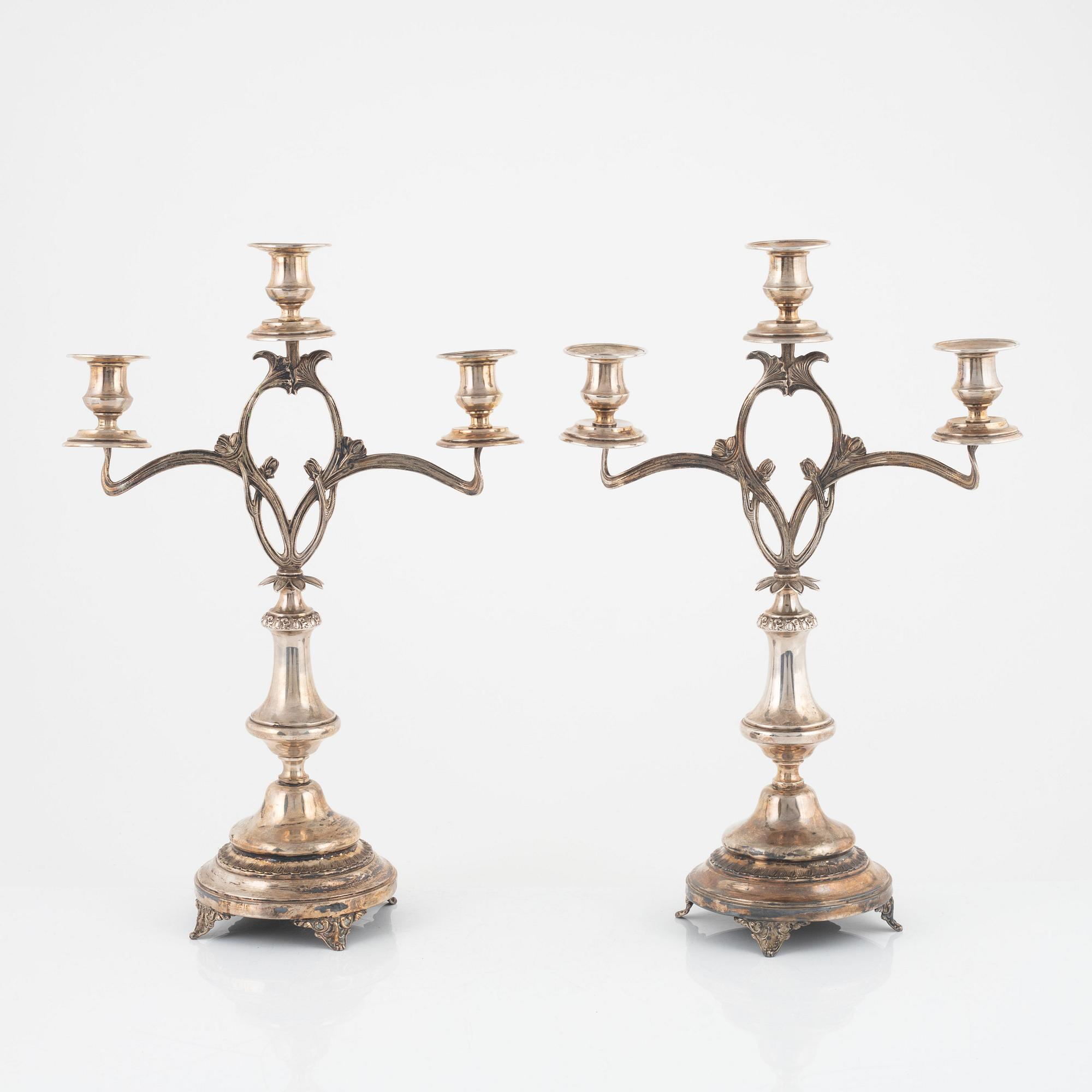 A pair of Art Nouveau silver plated candelabras, early 20th Century.