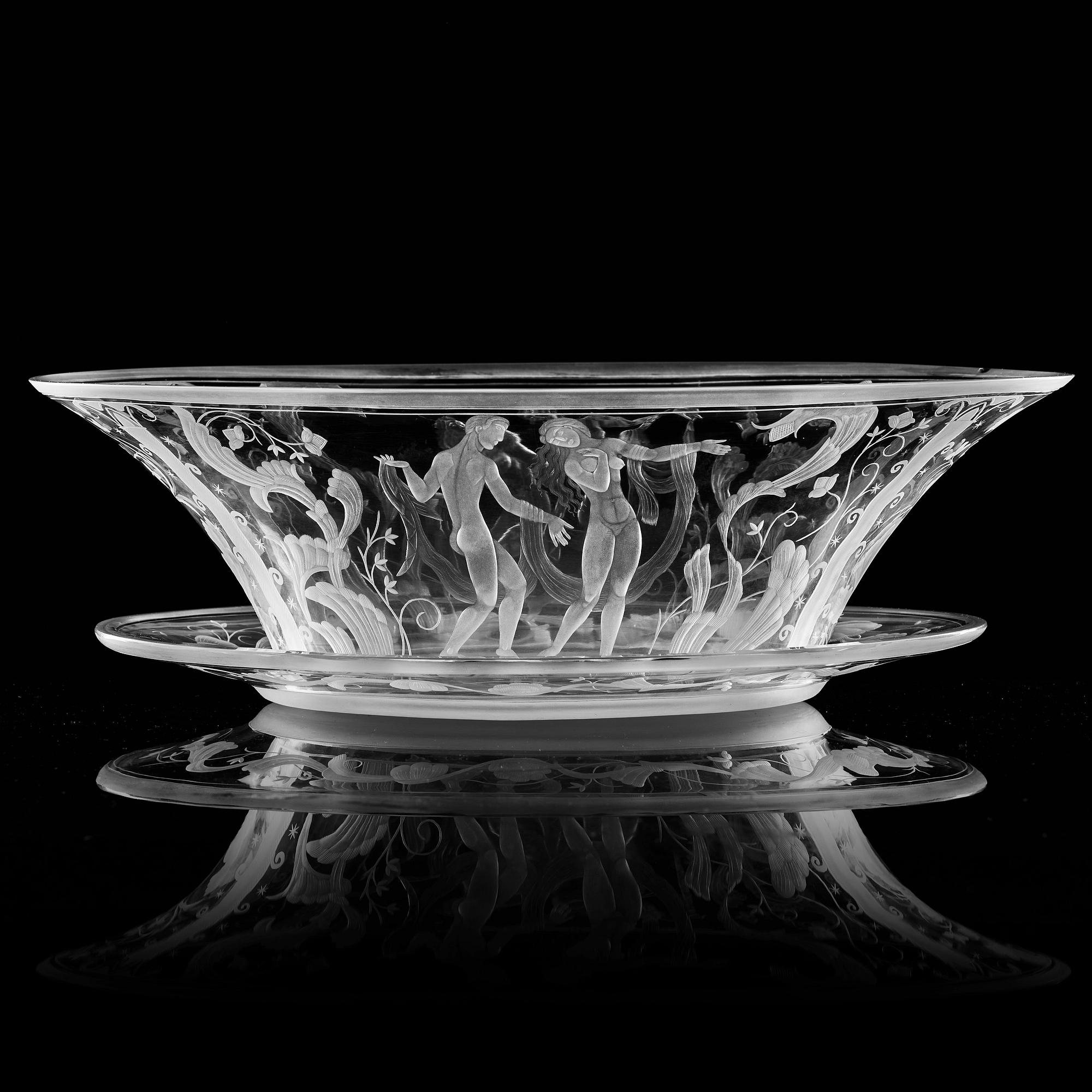 Simon Gate, a Swedish Grace engraved glass bowl with stand, Orrefors 1930, model 147, engraved by Karl Rössler.