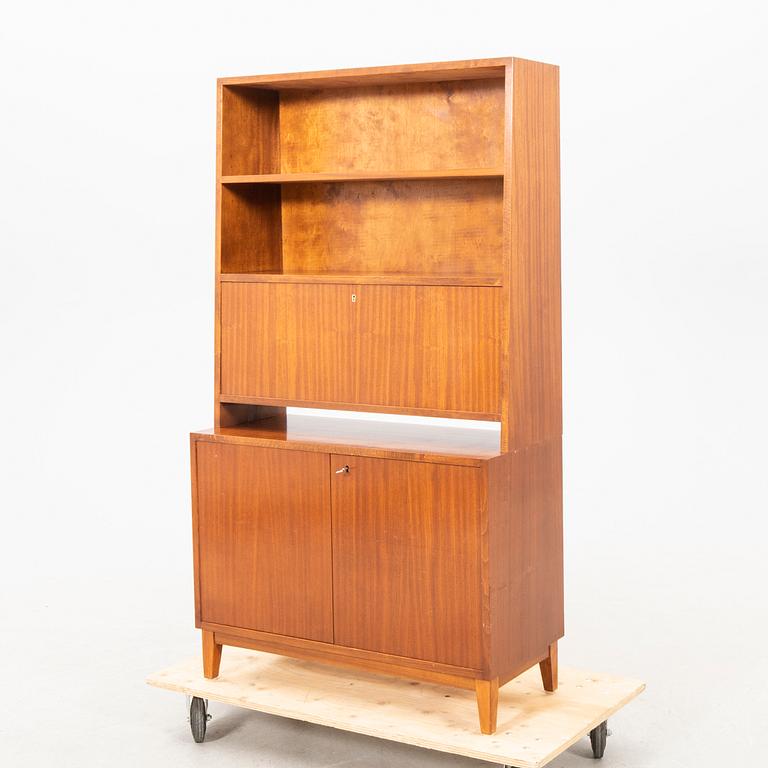 A 1940s mahogany book shelf with writing desk.