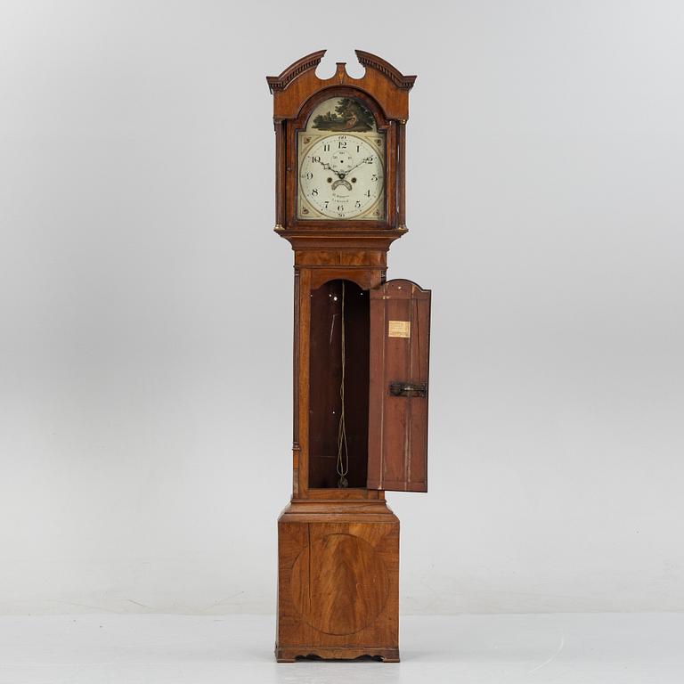 A mahognay long case clock from around the year 1800, H Bunyan Lincoln.