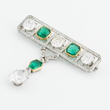 An impressive platinum, step-cut emerald and old-cut diamond brooch by W.A. Bolin likely Moscow 1912-1917. No hallmarks.