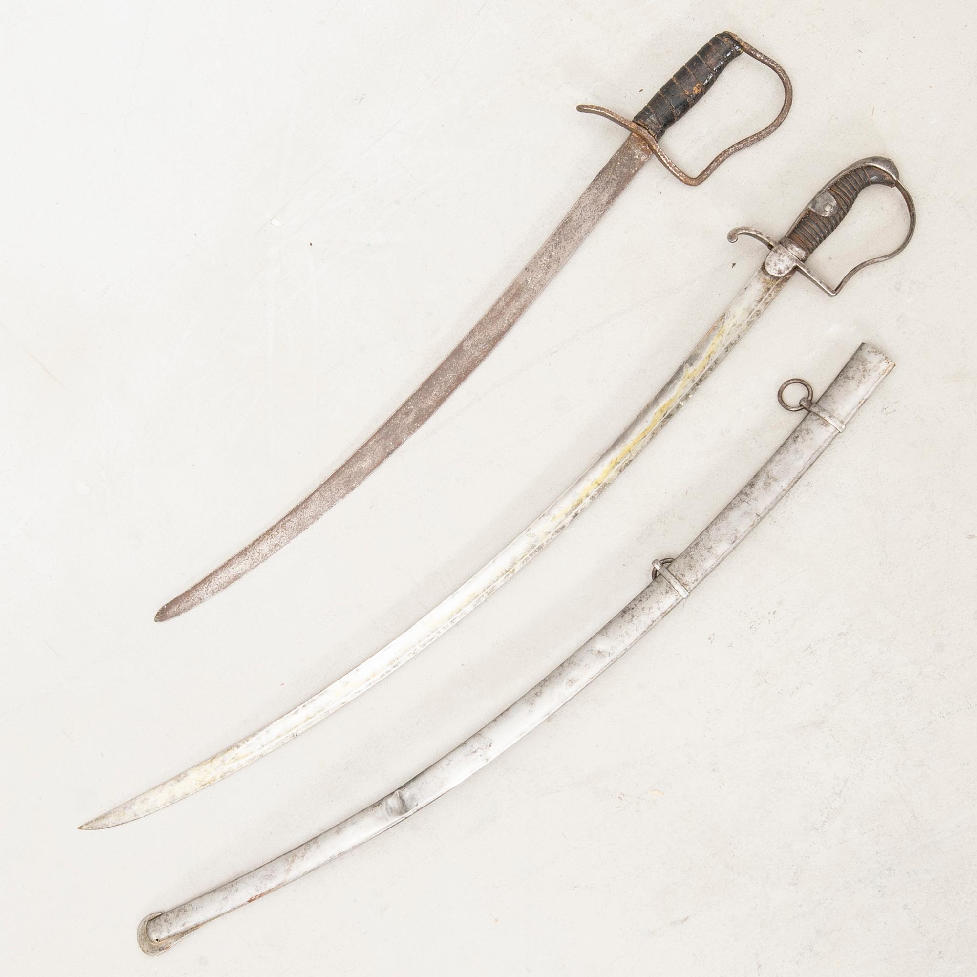 A German sabre with scabbard and a cutlass.