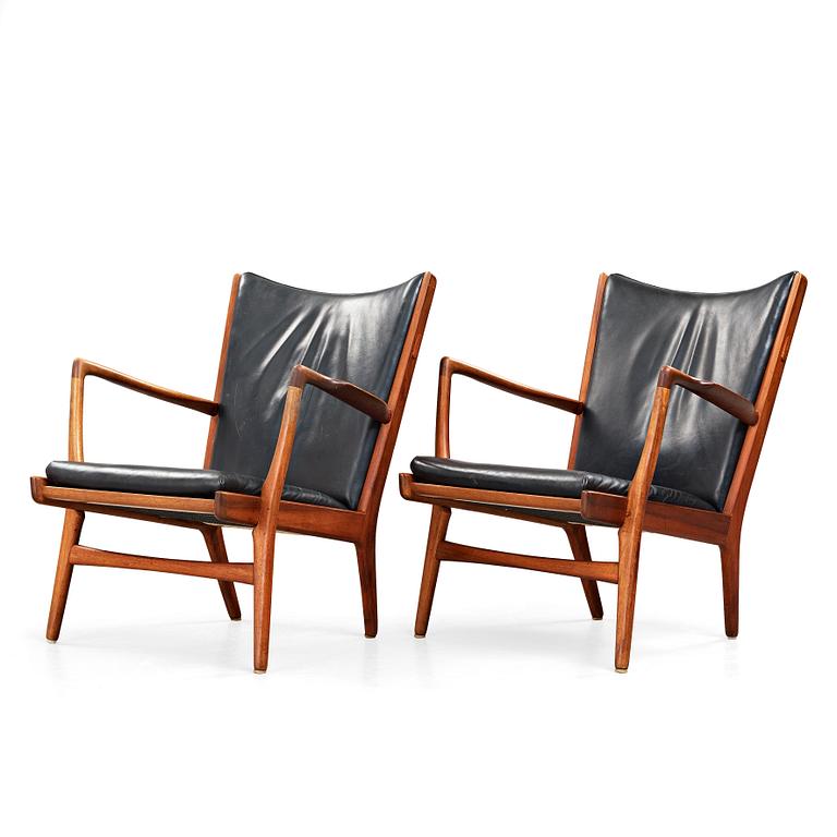 Hans J. Wegner, a pair of "AP16" teak and black leather armchairs, AP-stolen, Denmark 1950-60´s.