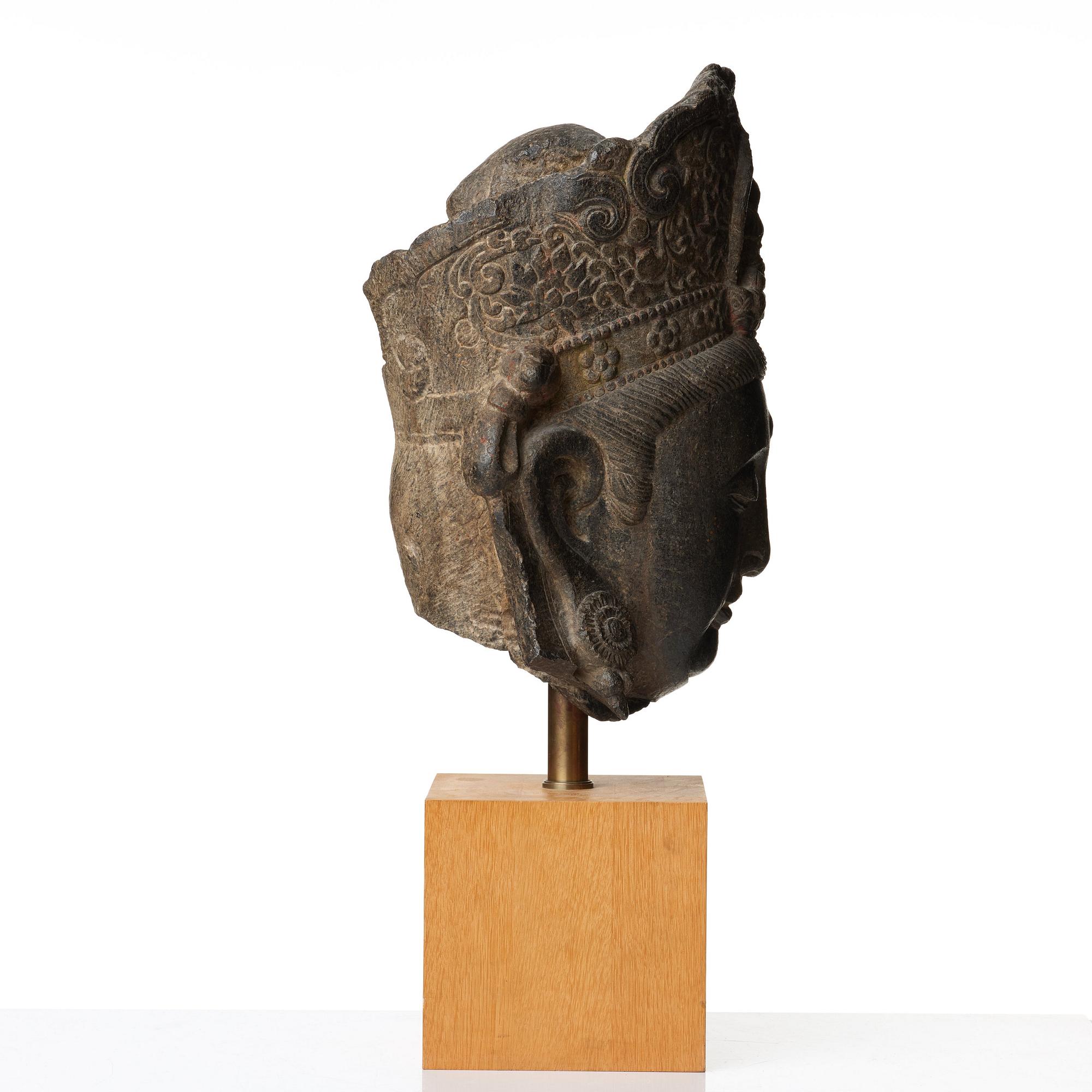 A large sculptured stone head of Guanyin, Ming dynasty (1368-1644).