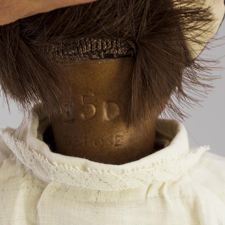 A bisque head doll marked E.D depoussé, France, early 20th century.