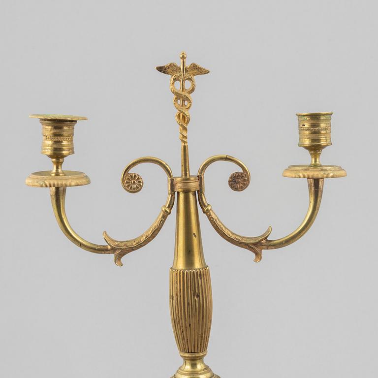 A pair of brass candelabra, first half/mid 19th century.