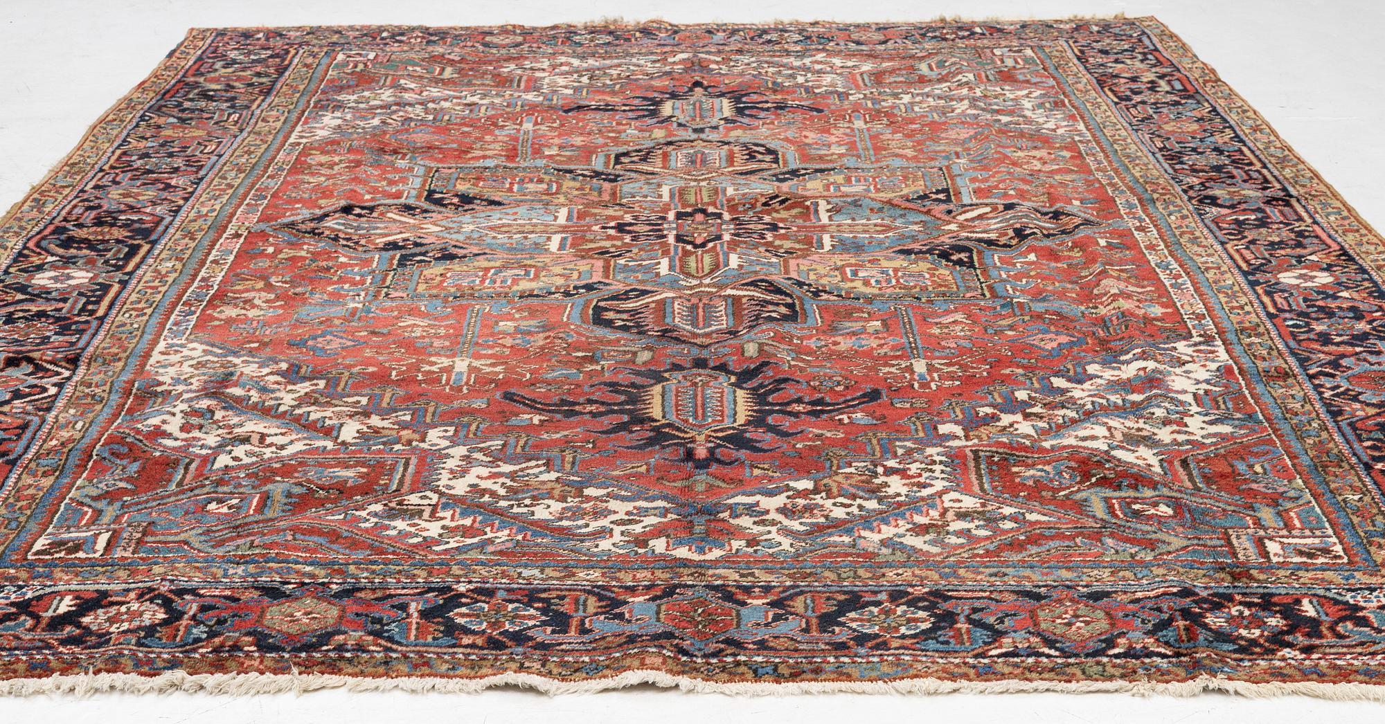 A semi-antique Heris carpet, west persia c. 322 x 252 cm.