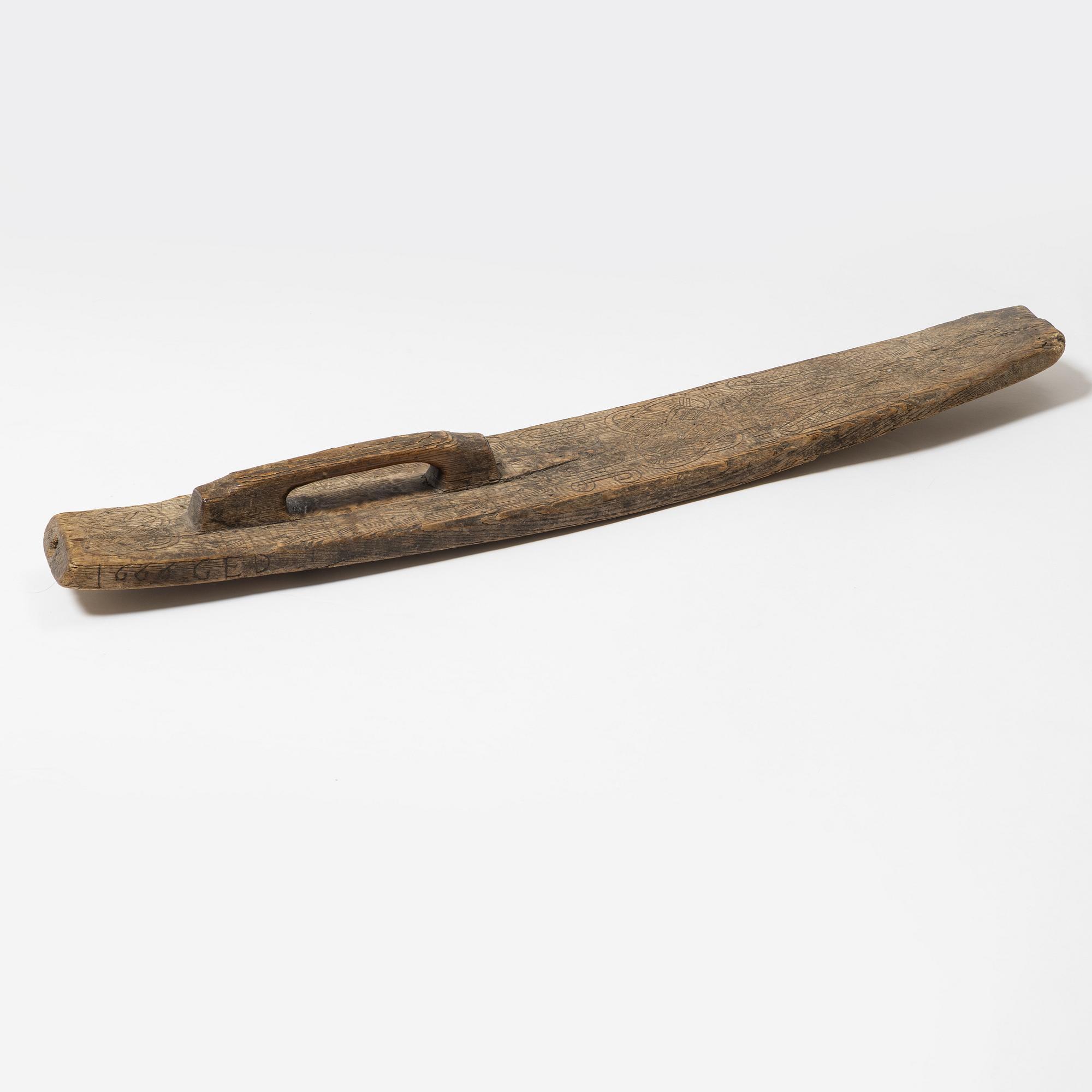 A Swedish folk art mangle board, dated 1666.